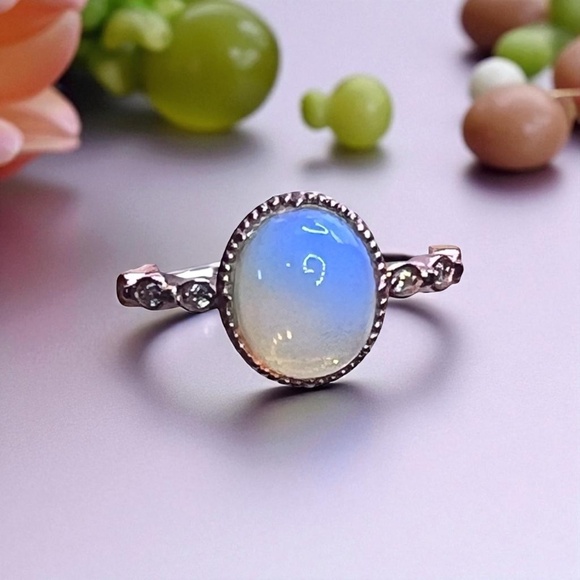 Beautiful gold color ring with bluish white opal looking stone. - Picture 1 of 8